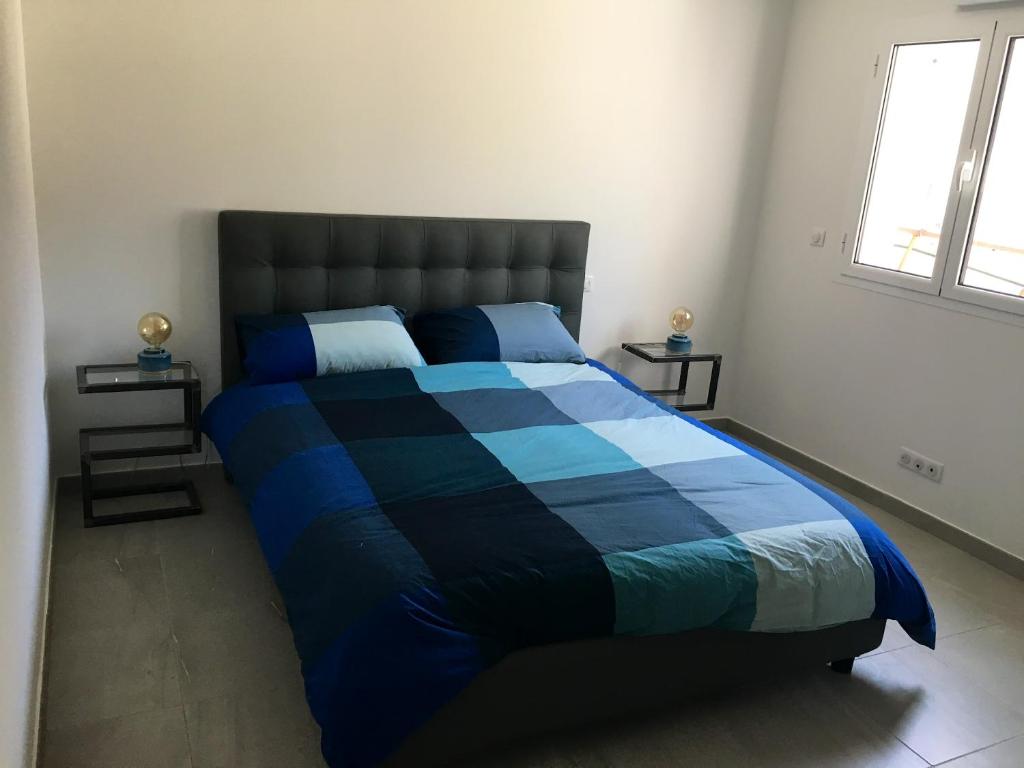 Posteľ alebo postele v izbe v ubytovaní Appartement moderne à Bastia de 57 m² avec vue mer exclusive