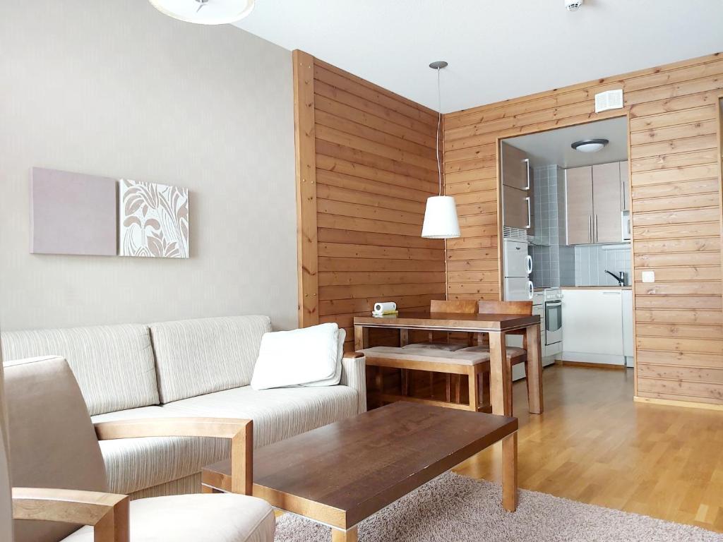 Posezení v ubytování Ylläs Saaga Ski Chalets 2