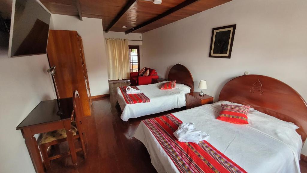Postel nebo postele na pokoji v ubytování Casa Kuelap Hostal