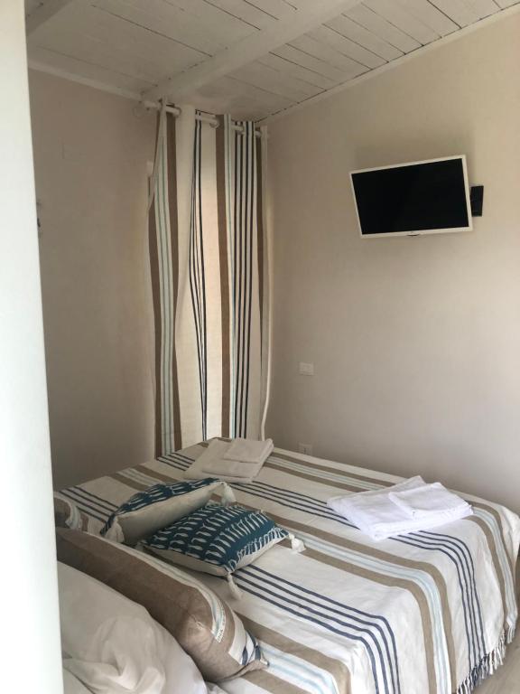 A bed or beds in a room at l' Acciuga Blu