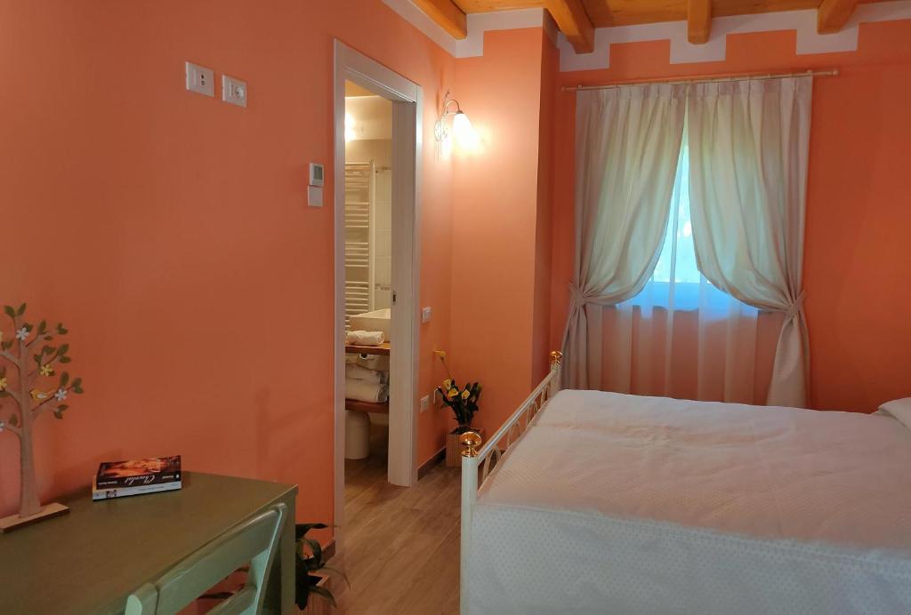 Postel nebo postele na pokoji v ubytování Le Acacie