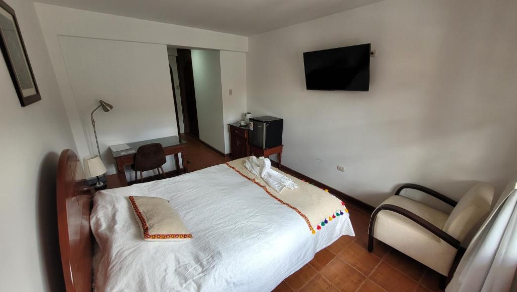 Postel nebo postele na pokoji v ubytování Casa Kuelap Hostal