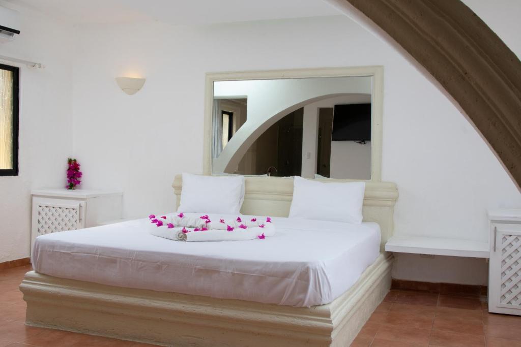 Postel nebo postele na pokoji v ubytování Aparthotel Castillo Real
