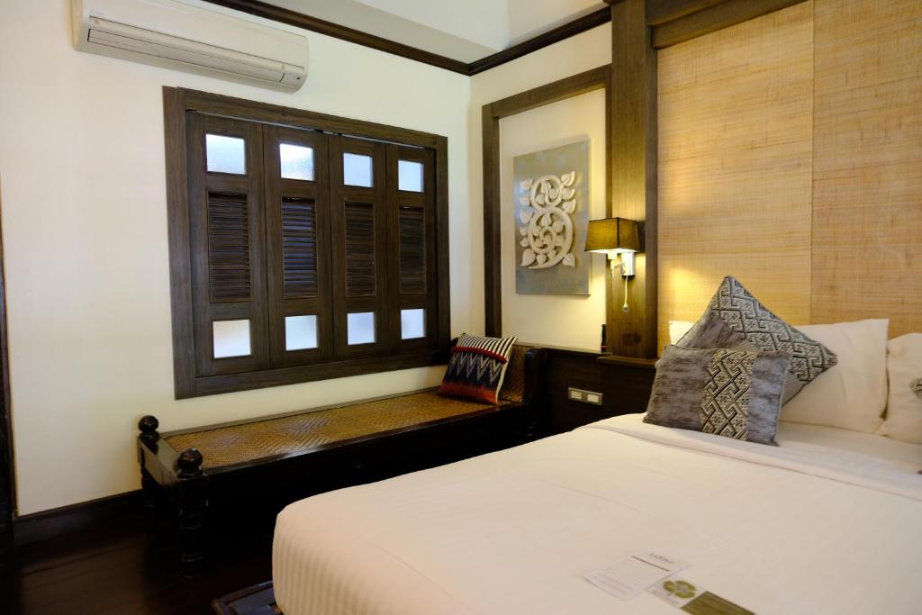 Postel nebo postele na pokoji v ubytování Bodhi Serene, Chiang Mai - SHA Extra Plus
