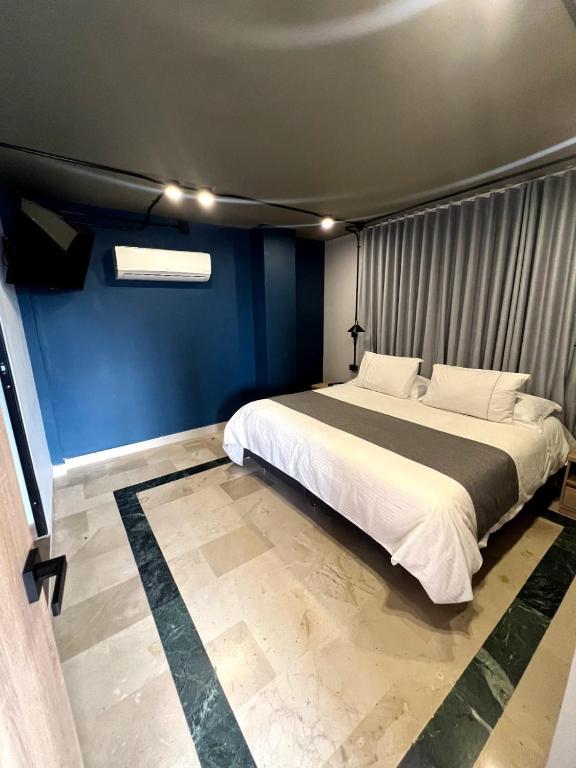 Postel nebo postele na pokoji v ubytování Hotel D' Leon