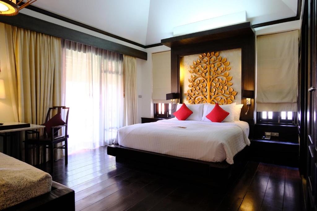 Postel nebo postele na pokoji v ubytování Bodhi Serene, Chiang Mai - SHA Extra Plus