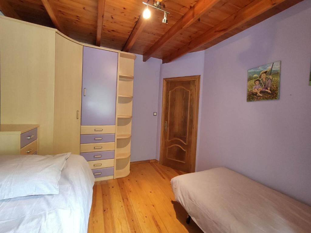A bed or beds in a room at Casa Elvira