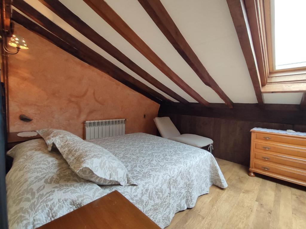 A bed or beds in a room at Casa Elvira