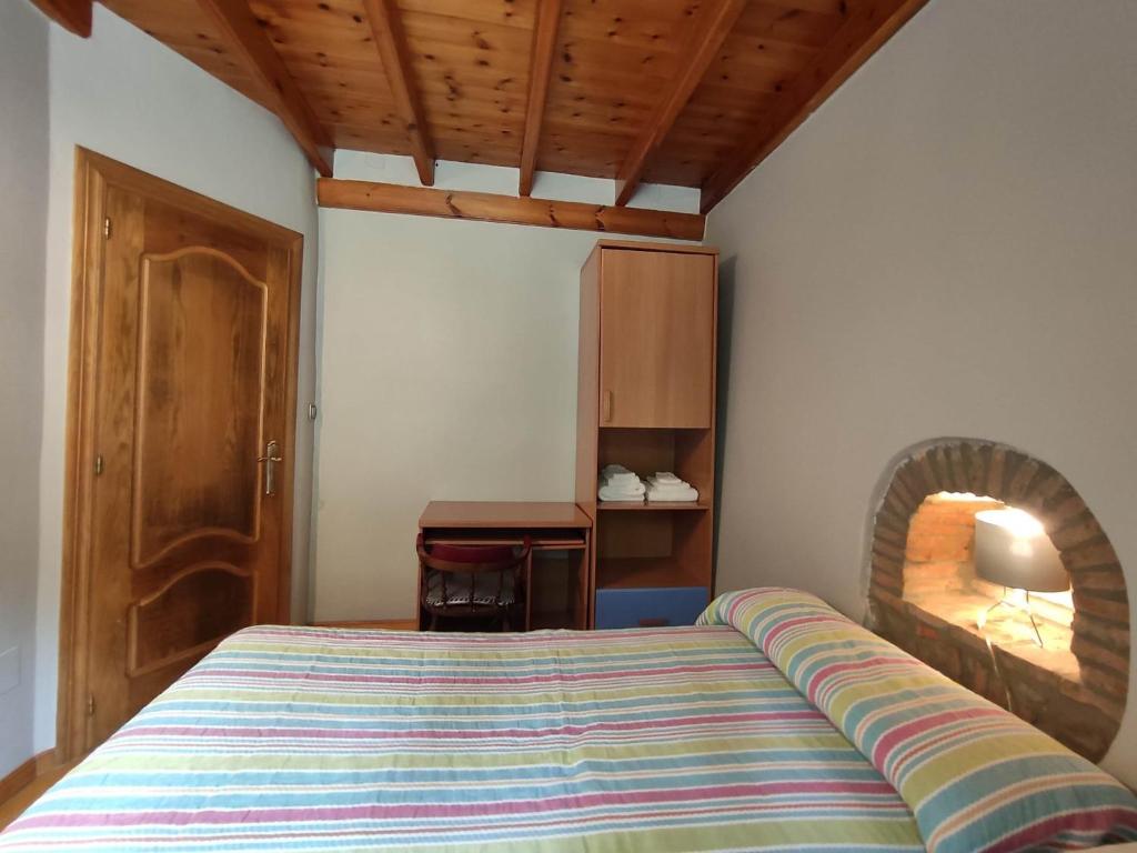 A bed or beds in a room at Casa Elvira