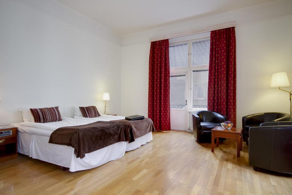 Postel nebo postele na pokoji v ubytování First Hotel Stadt