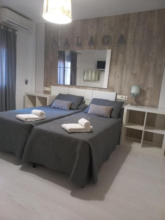 Posteľ alebo postele v izbe v ubytovaní Apartamento E&R Málaga Centro- Parking gratis