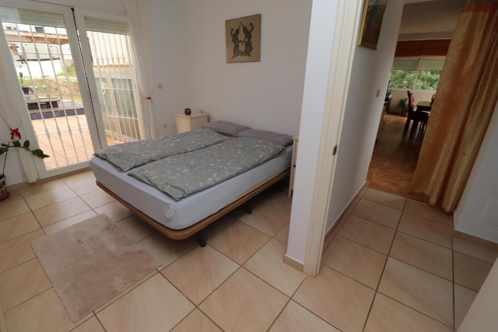 Postel nebo postele na pokoji v ubytování Casa Home Golf Playa