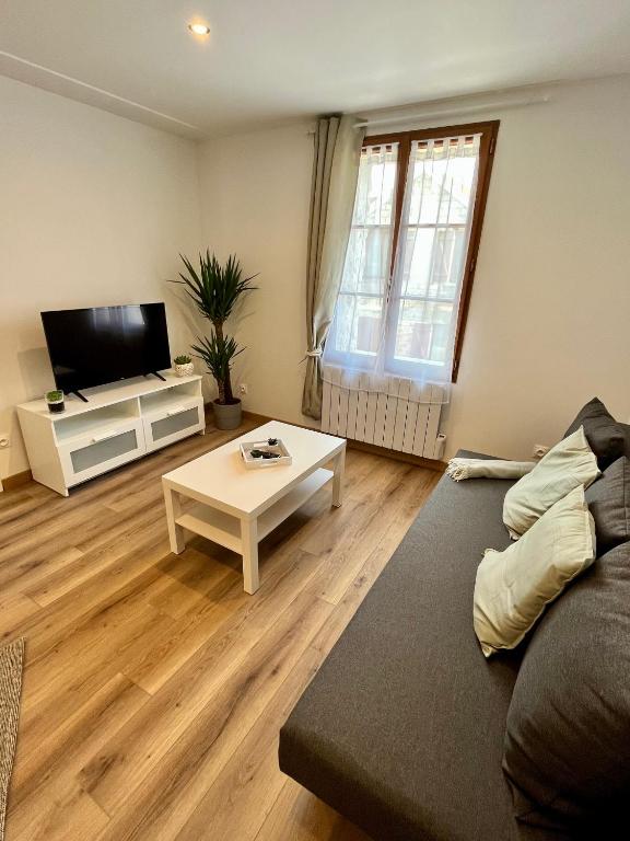 Televízia a/alebo spoločenská miestnosť v ubytovaní La Pause Cosy