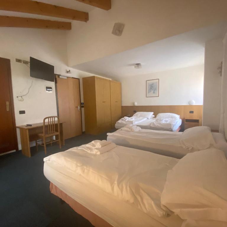 Postel nebo postele na pokoji v ubytování Hotel Olisamir