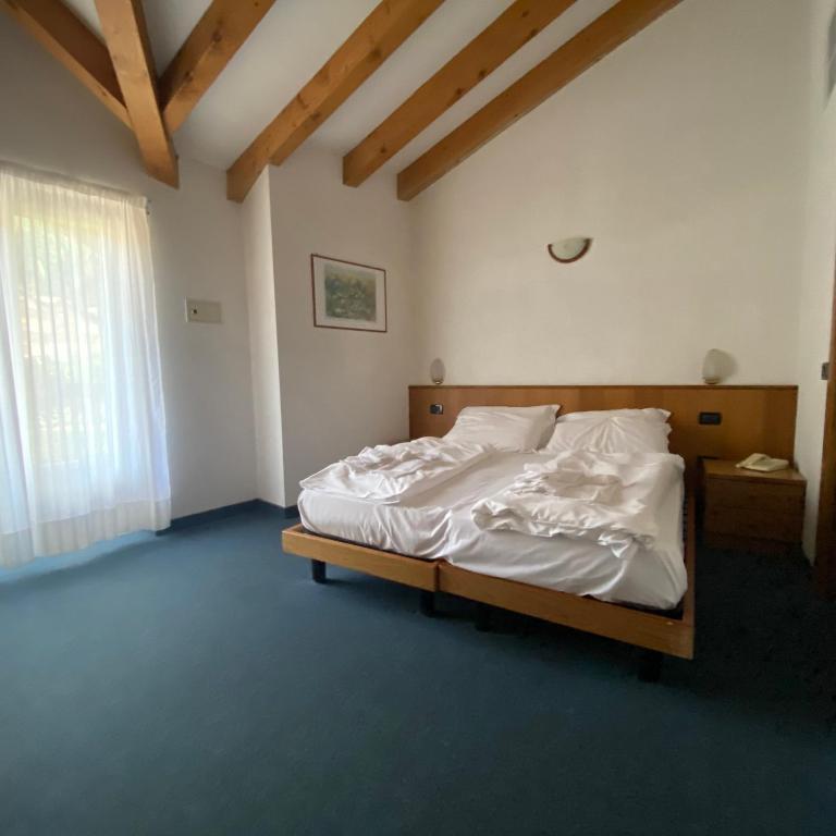 Postel nebo postele na pokoji v ubytování Hotel Olisamir