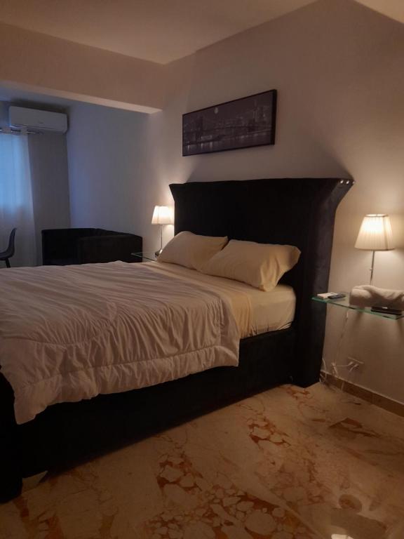 Postel nebo postele na pokoji v ubytování LK Apartamentos Amueblados