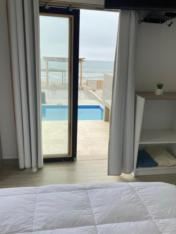Postel nebo postele na pokoji v ubytování Riviera Vichayito