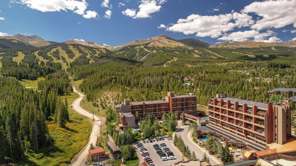 an aerial view of a hotel with mountains in the background at Beaver Run Resort in Breckenridge