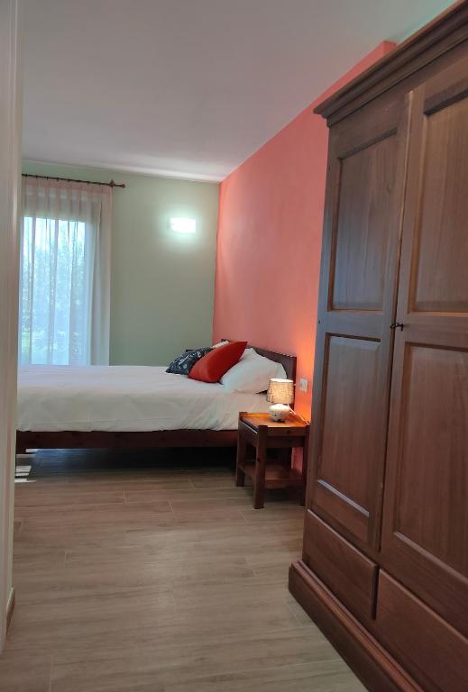 Postel nebo postele na pokoji v ubytování Le Acacie