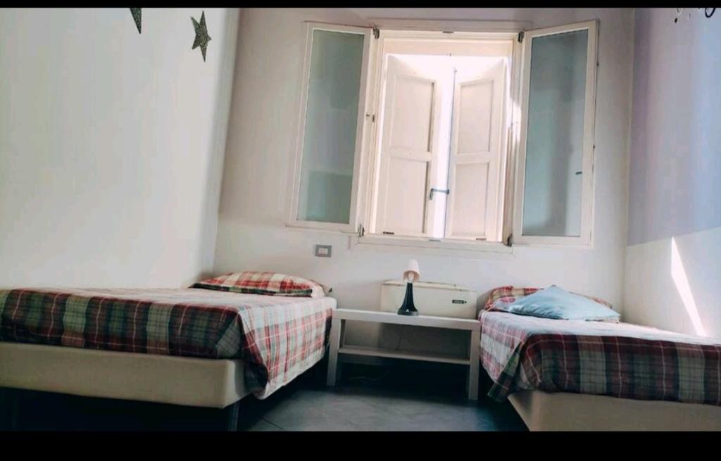 Łóżko lub łóżka w pokoju w obiekcie La *Bastia*