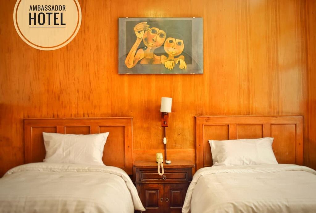 Postel nebo postele na pokoji v ubytování Hotel Ambassador