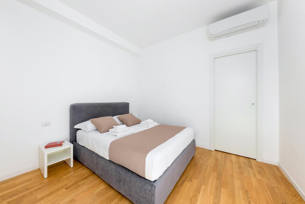 Posteľ alebo postele v izbe v ubytovaní Casa da Suite Centrale