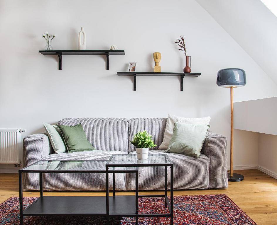 a living room with a couch and a table at Schöne Ferienwohnung in Gernsbach Zentrum in Gernsbach