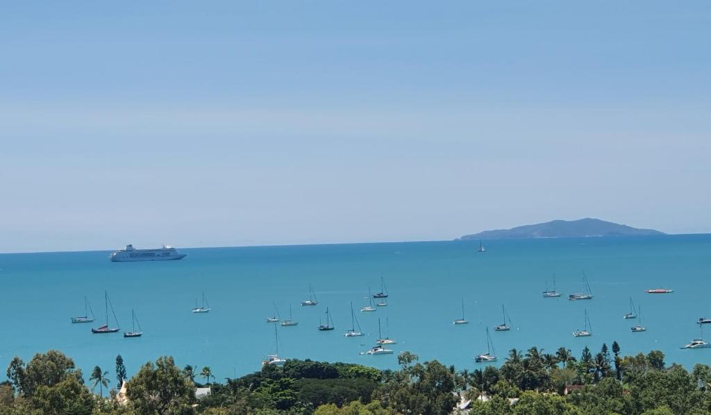 a group of boats in a large body of water at Bella Vista on Nara Stay 4n each guest get free Day trip Kens Klassic Kombi in Airlie Beach