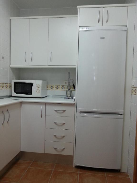 Kuchyň nebo kuchyňský kout v ubytování Apartamento unifamiliar Golf Vera urb privada y tranquila
