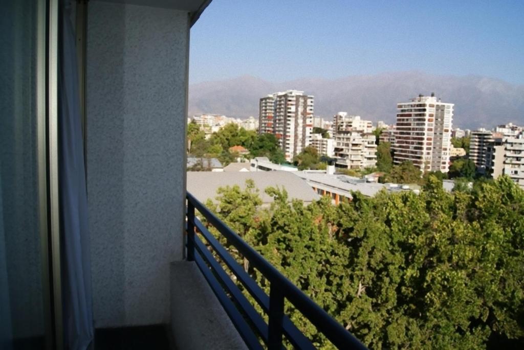 a balcony with a view of a city at Lobato Apartments in Santiago