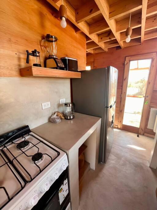 Kuchyň nebo kuchyňský kout v ubytování Mandala Tiny House, Traslasierra.