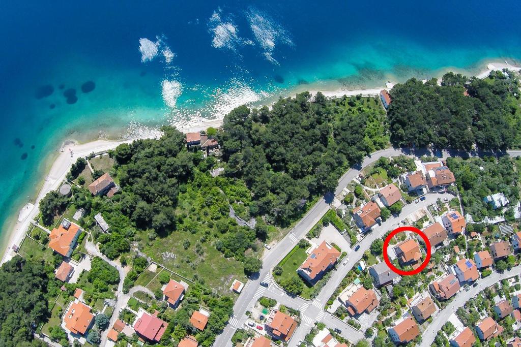 an aerial view of a house on a beach at Apartments with a parking space Cres - 16178 in Cres