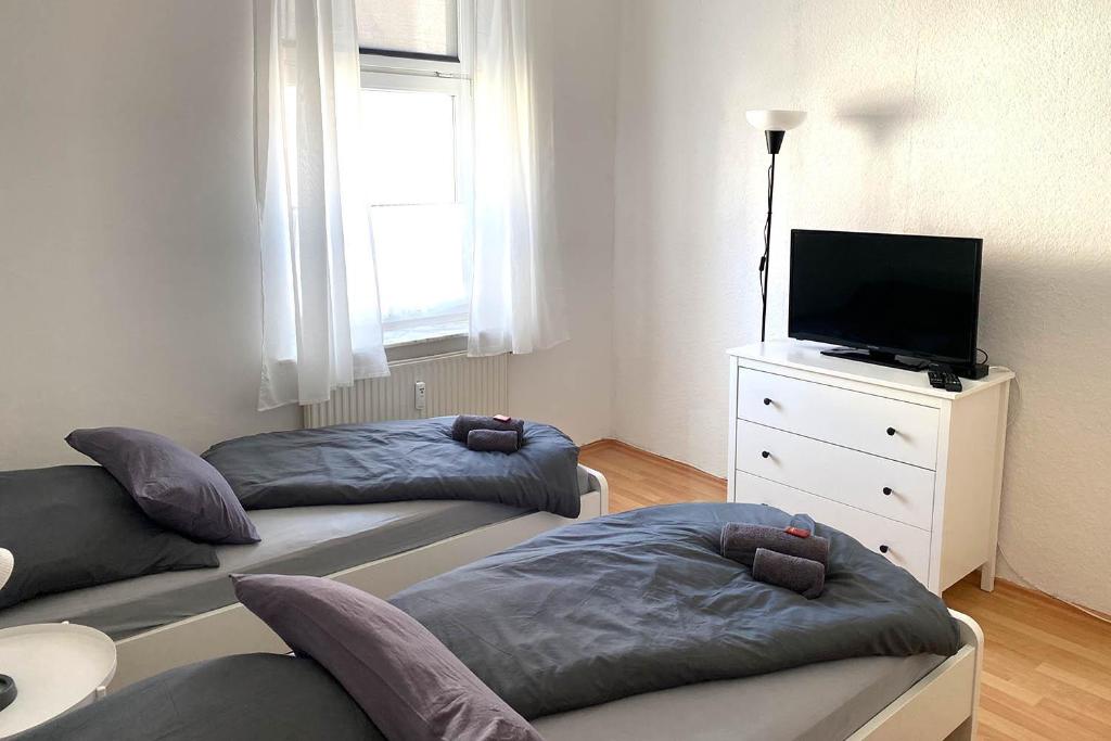 Posteľ alebo postele v izbe v ubytovaní Cozy Apartments in Zwickau