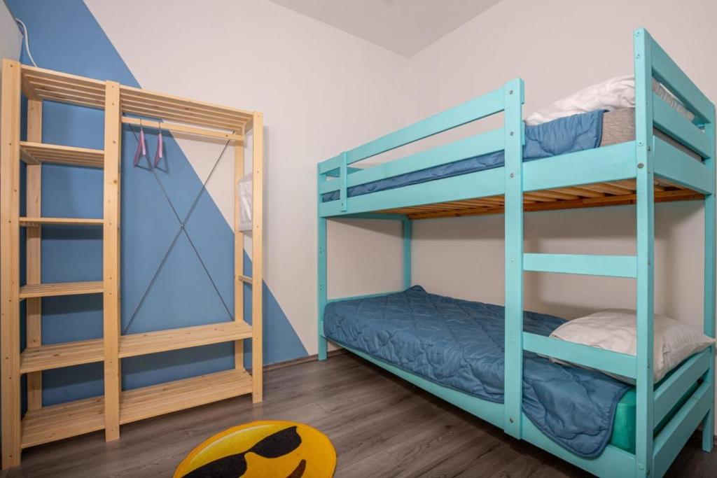 two bunk beds in a room with a soccer ball at Apartments with a parking space Jusici, Opatija - 15874 in Kastav