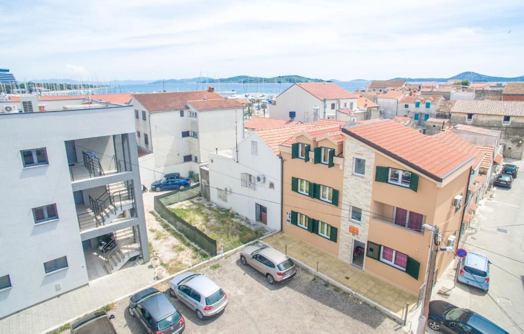 an aerial view of a city with cars parked in a parking lot at Apartment Vodice 16249b in Vodice