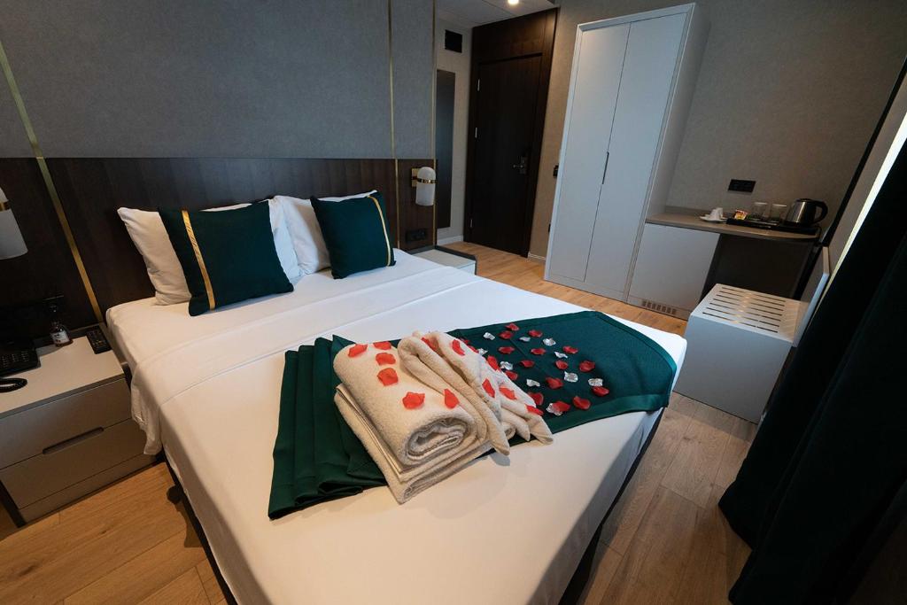 Postel nebo postele na pokoji v ubytování Costera Hotel