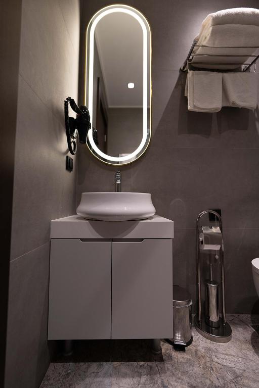 Koupelna v ubytování Costera Hotel