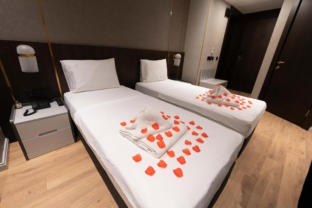 Postel nebo postele na pokoji v ubytování Costera Hotel