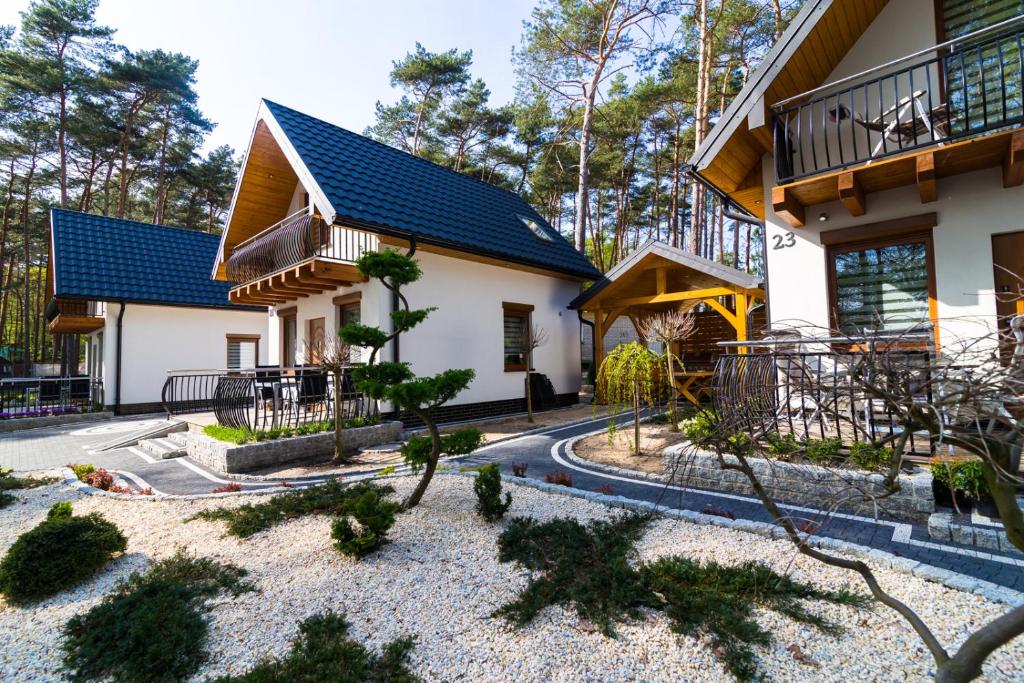 a house with a garden in front of it at Zatoczka Turawa in Turawa