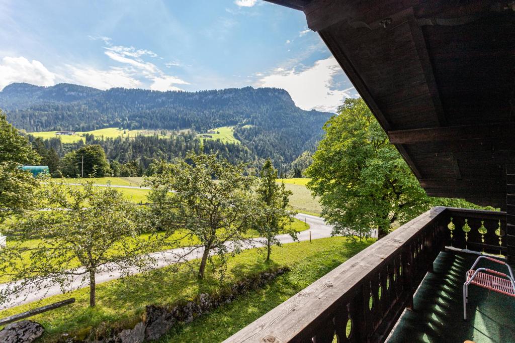 a balcony with a view of a valley and mountains at Ferienwohnung Weissbacher in Sankt Martin bei Lofer