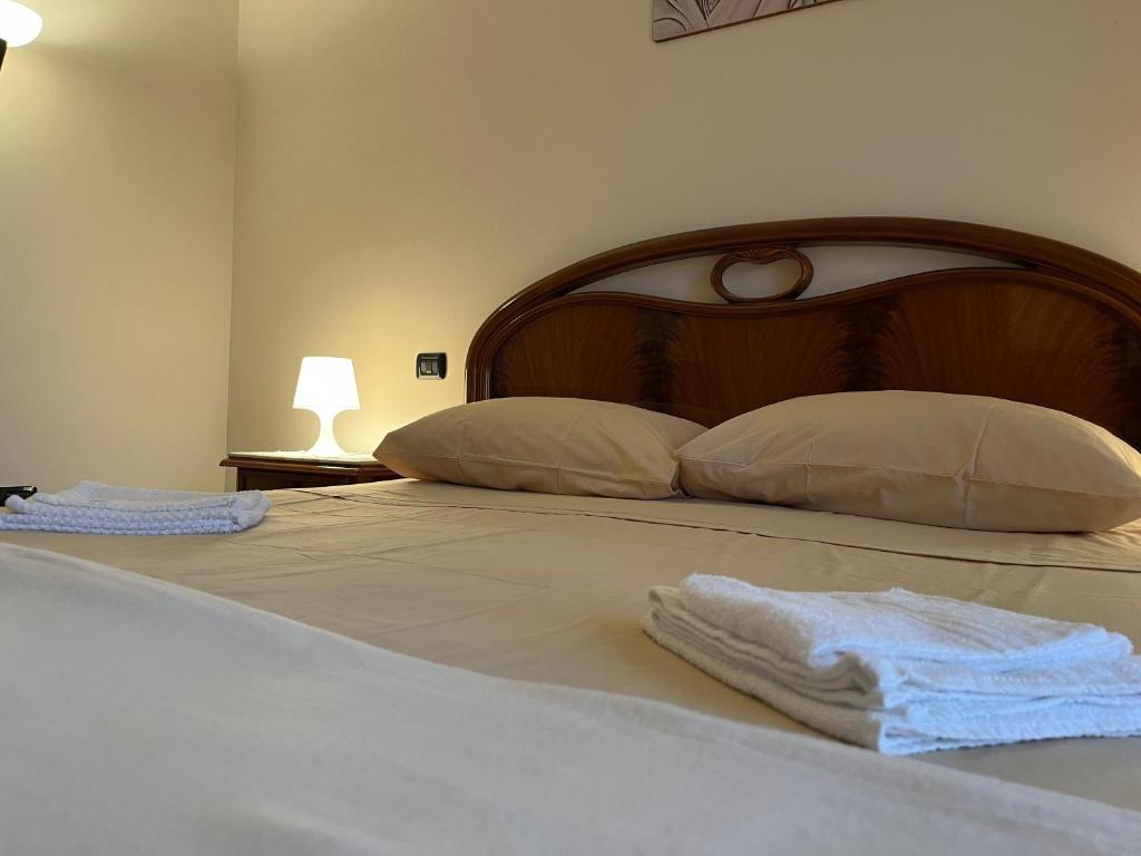 Postel nebo postele na pokoji v ubytování [Apulian Heart] Elegante Appartamento