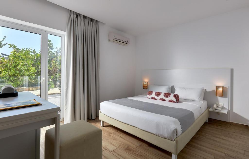 Postel nebo postele na pokoji v ubytování Blu Acqua Hotel