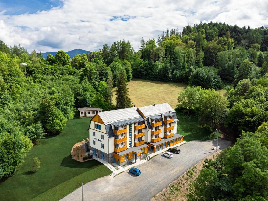 an aerial view of a large house in the woods at Hotel Edvard in Frenštát pod Radhoštěm