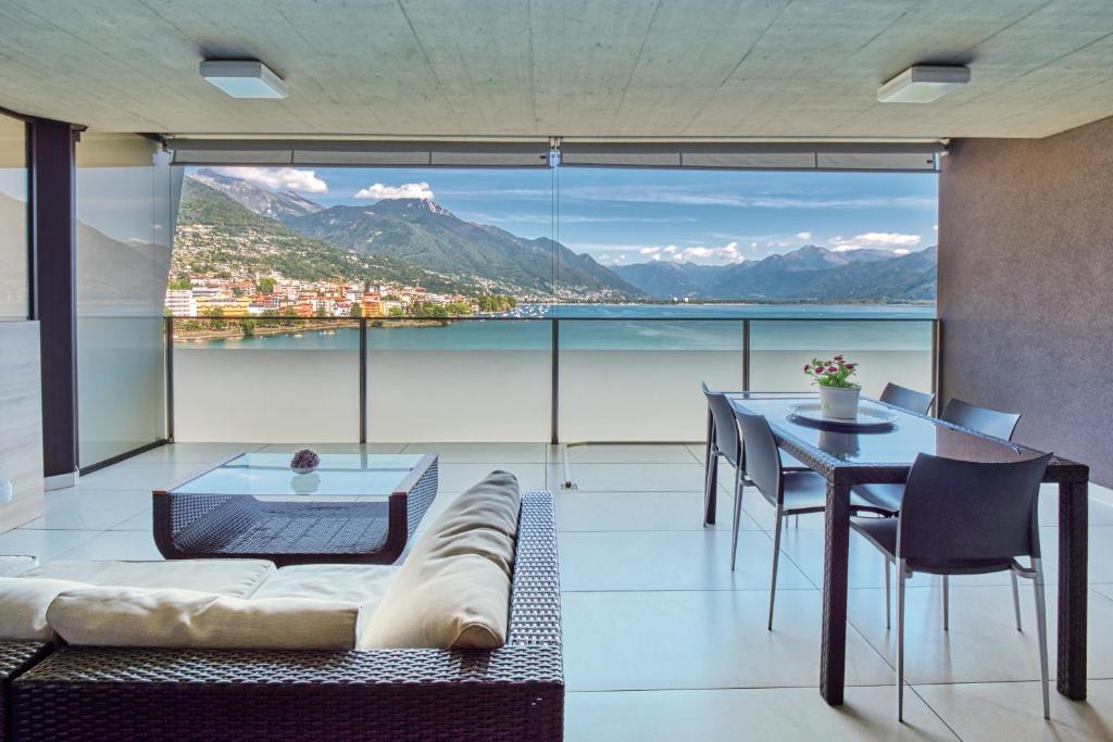 a living room with a couch and a table at Residenza Vivian in Locarno