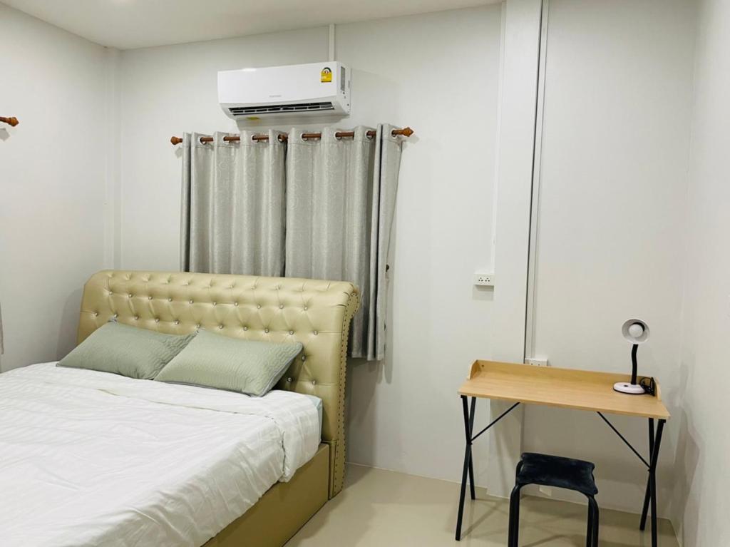 Postel nebo postele na pokoji v ubytování Phu Thai Resort