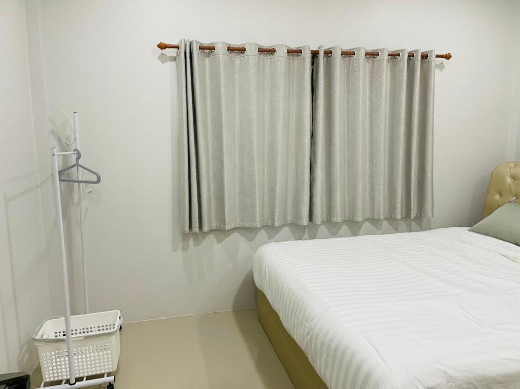 Postel nebo postele na pokoji v ubytování Phu Thai Resort