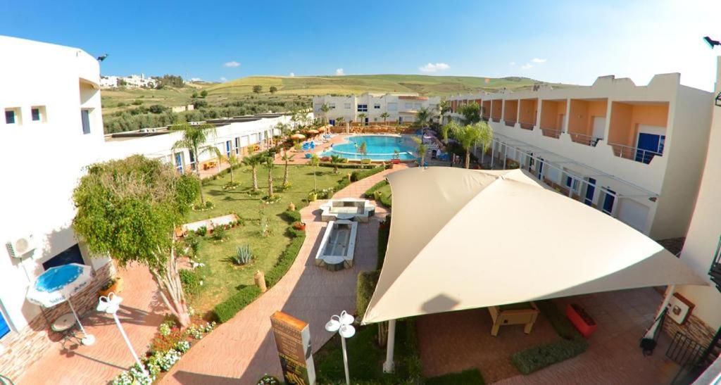 an overhead view of a resort with a swimming pool at Hotel Al Akha in Sidi Harazem