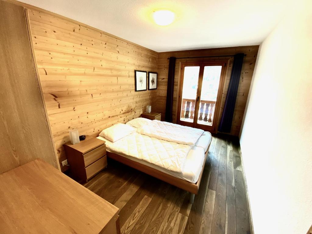 Postel nebo postele na pokoji v ubytování Chalet Les Dalton, Morgins