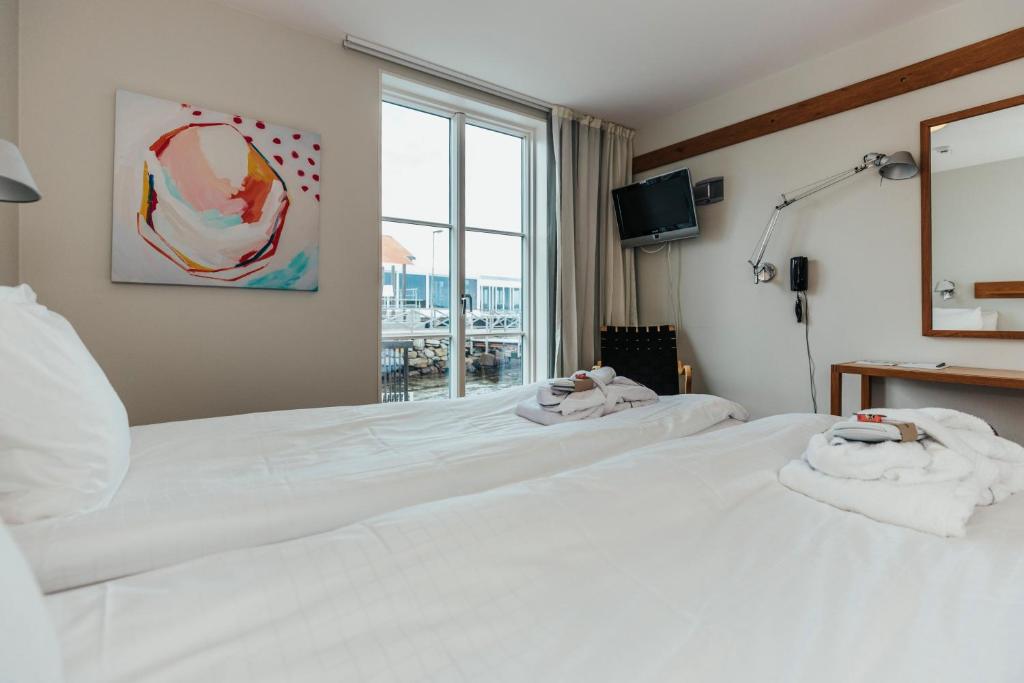 Postel nebo postele na pokoji v ubytování Gullmarsstrand Hotell & Konferens