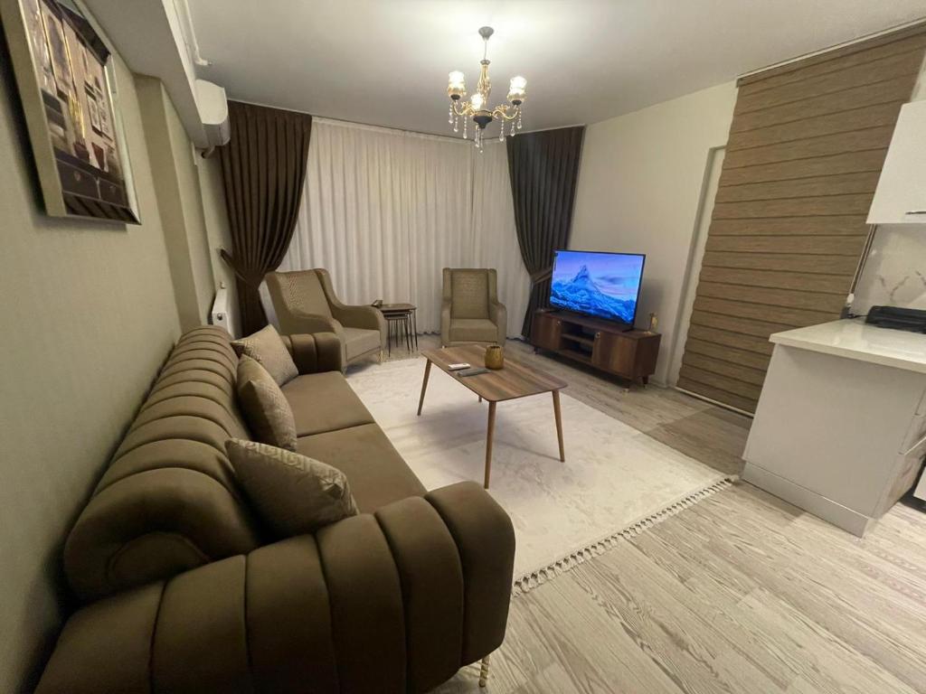 TV a/nebo společenská místnost v ubytování King Suite AM2